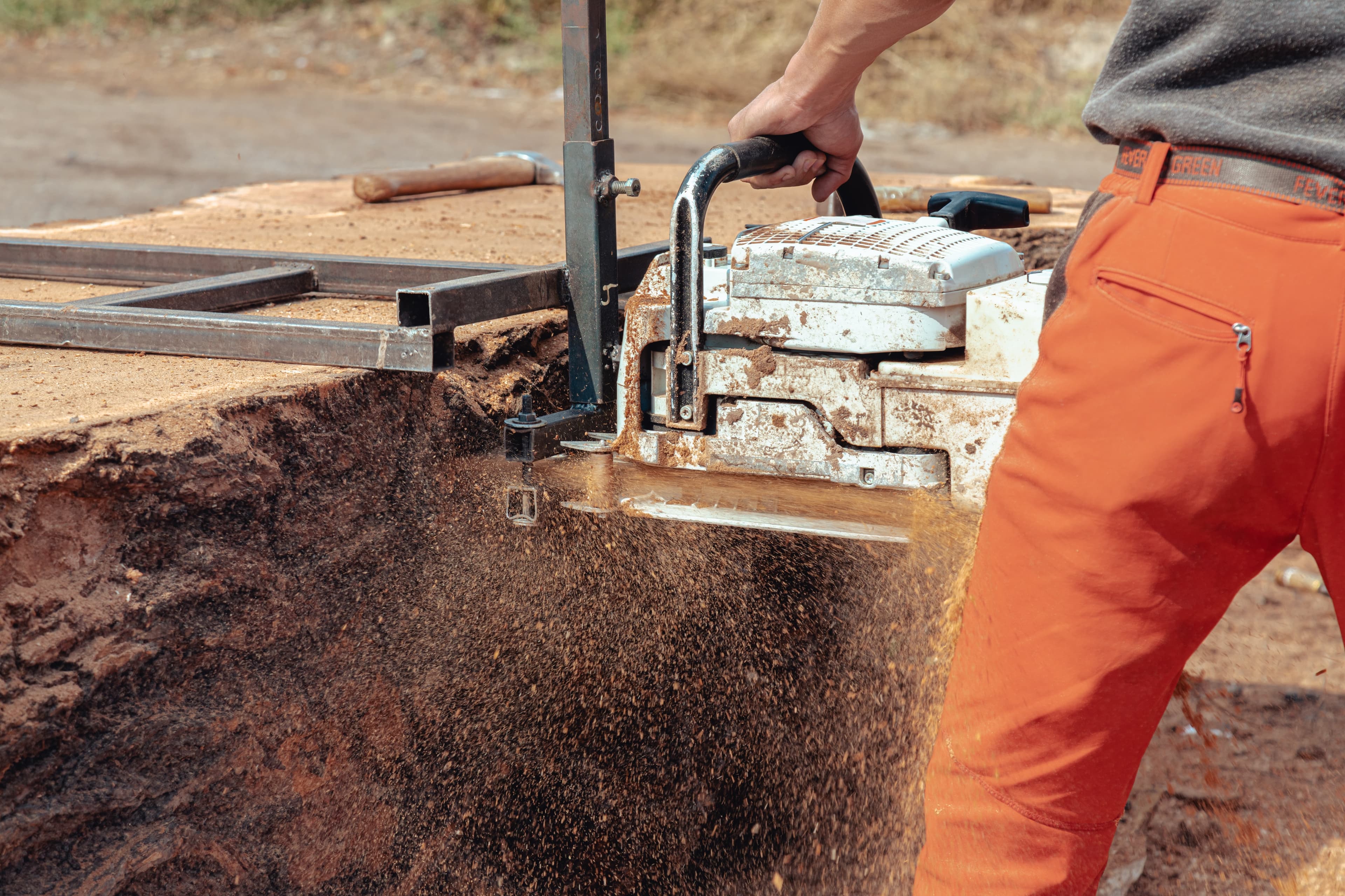 A man cutting a tree